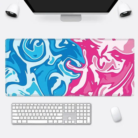 Pink and Blue Mouse Pad next to other computer supplies on a white background